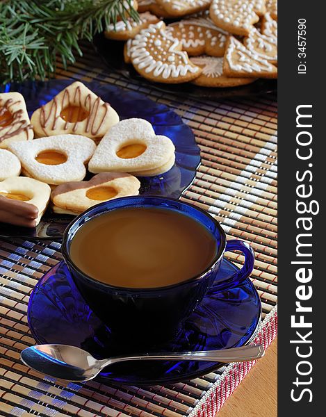 The Christmas cookies with coffee on the table.