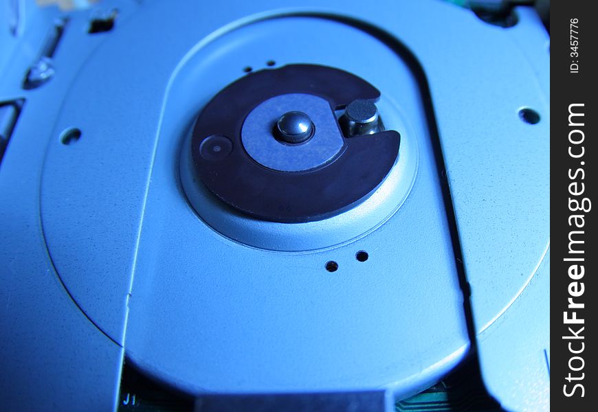 Computer harddrive close up in blue colors. Computer harddrive close up in blue colors