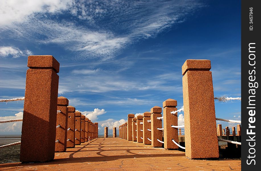 Beautiful focus a port jetty image on the blue sky background