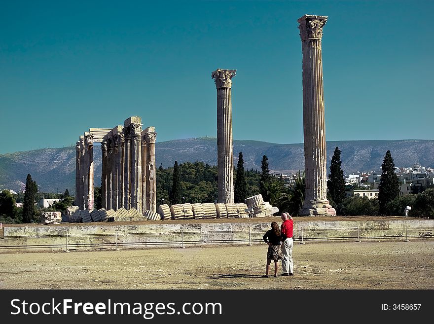 A pair of tourists at the Temple of Olympian Zeus in Athens, Greece