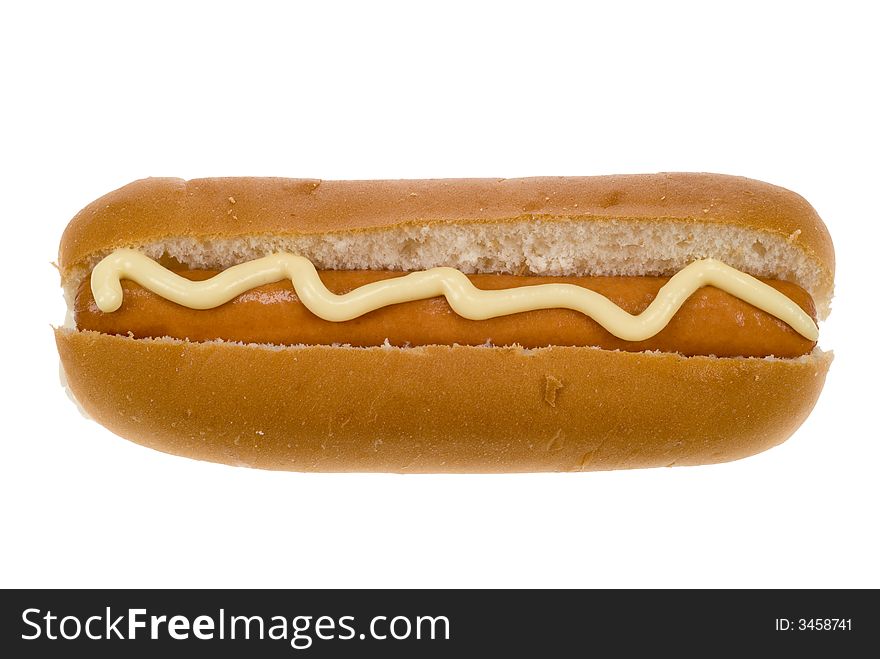 Hot dog in a bun with mayonaise isolated on a white background. Hot dog in a bun with mayonaise isolated on a white background
