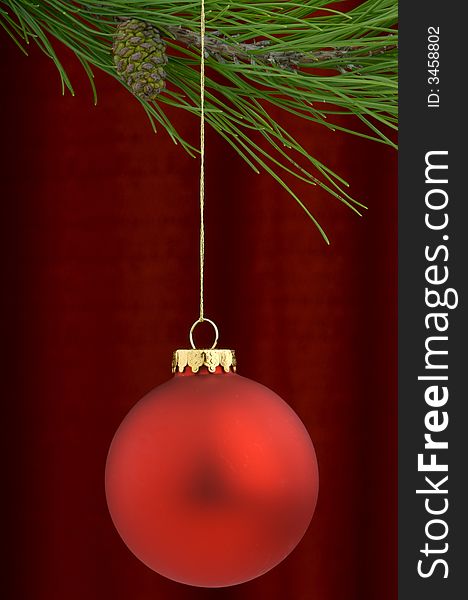 Red Christmas Ornament On A Burgundy Background