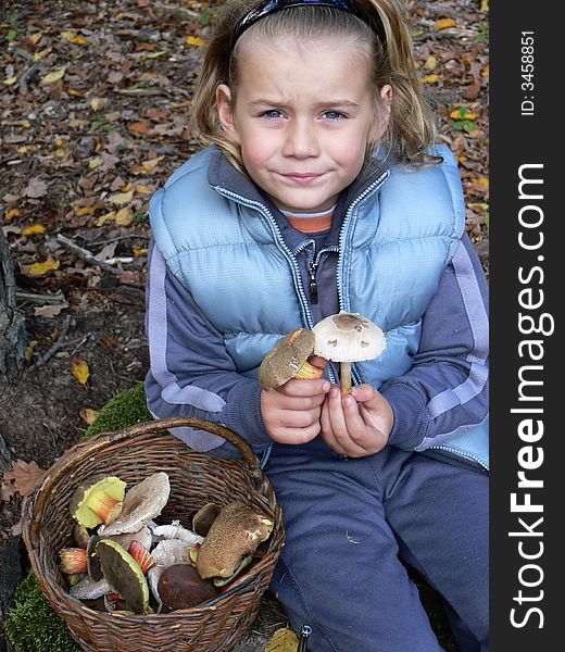 Small boy showing mushrooms