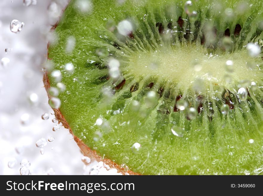 Close up of drops on the green fresh fruit