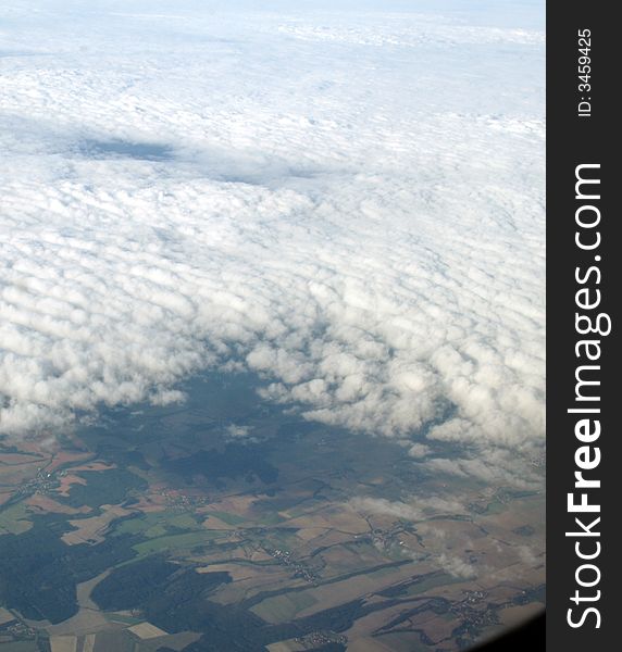 Clouds and earth, view in plane