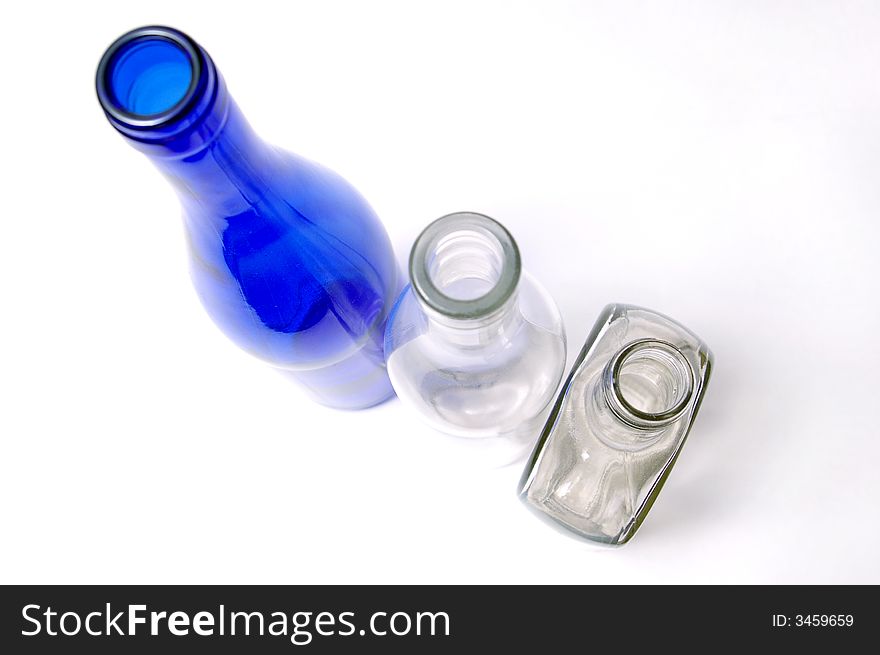 Three different bottles on a bel a background. Three different bottles on a bel a background