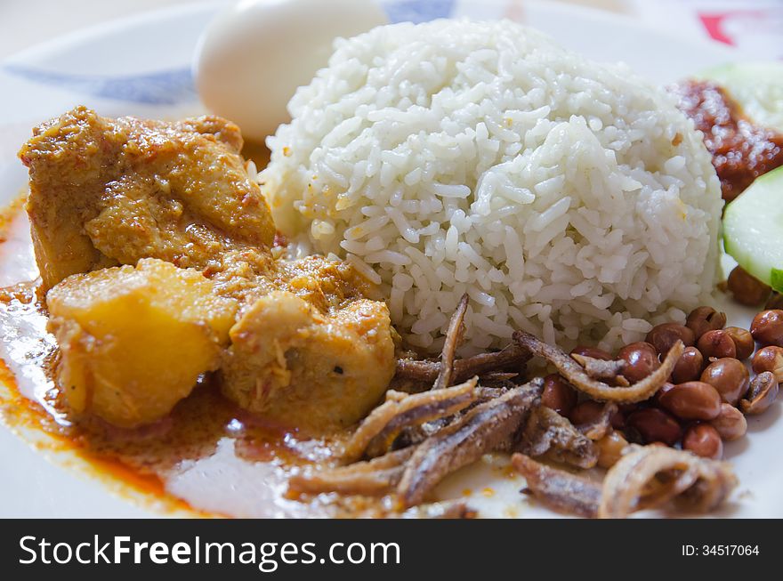 Chicken curry rice with peanuts and anchovies. Chicken curry rice with peanuts and anchovies