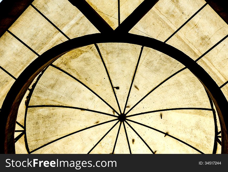 Texture of transparent domed roof with birds sitting on it. Meant to allow light to enter.