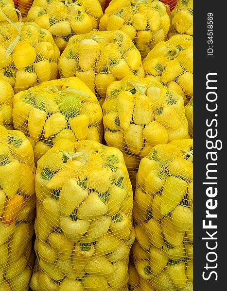 Yellow, hot bell peppers in plastic sacks. Yellow, hot bell peppers in plastic sacks