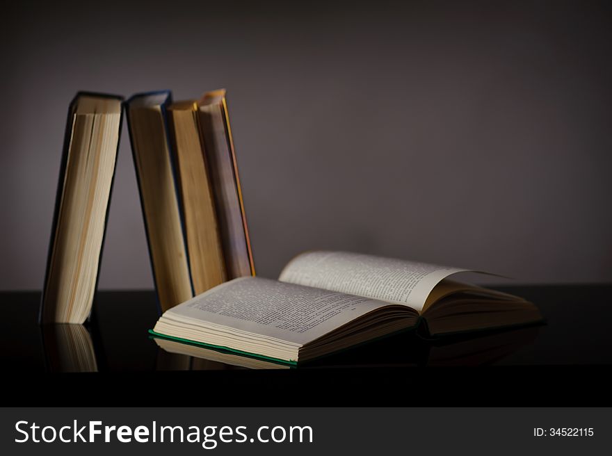 Vintage old books on wooden deck table and grunge background. Vintage old books on wooden deck table and grunge background