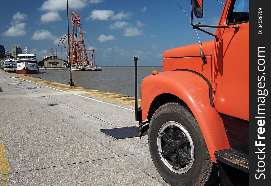 A loaded orange truck leaves Port in Belem (Amazonia), Brazil. It is one of the little ports of South America. A loaded orange truck leaves Port in Belem (Amazonia), Brazil. It is one of the little ports of South America.