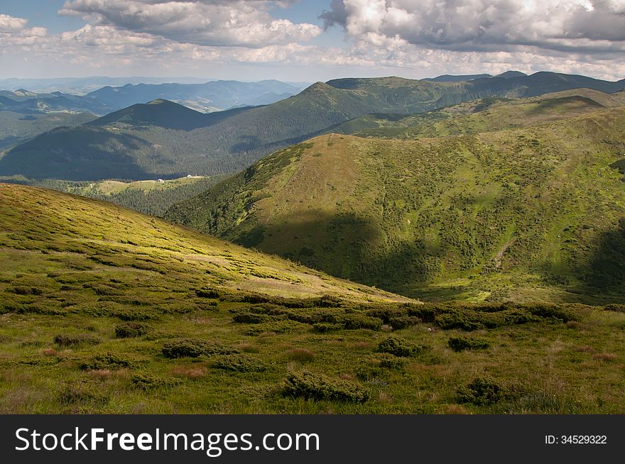 View from the mountains in the shadows of the clouds (view from The Hoverla mountain). View from the mountains in the shadows of the clouds (view from The Hoverla mountain)