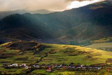 Light Beam Falls On Hillside With Autumn Forest In Mountain Stock Photos Light Beam Falls On Hillside With Autumn Forest In Mountain Stock Photos