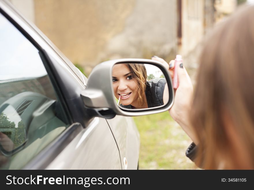 rearview mirror-beautiful girl make-up