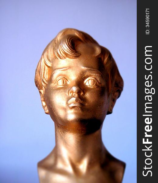 Head figure golden boy with blue background