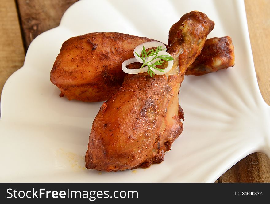 Chicken Tandoori is a highly popular Indian dish consisting of roasted chicken, yogurt, and spices. Chicken Tandoori is a highly popular Indian dish consisting of roasted chicken, yogurt, and spices.