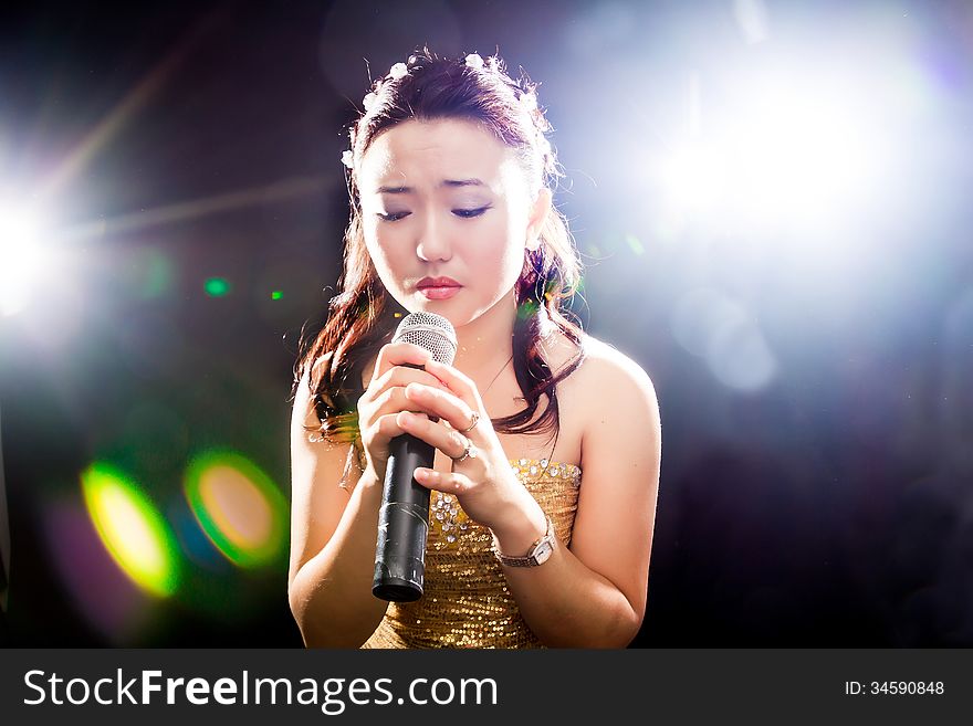 Concert young Asian singer of the girl. Concert young Asian singer of the girl