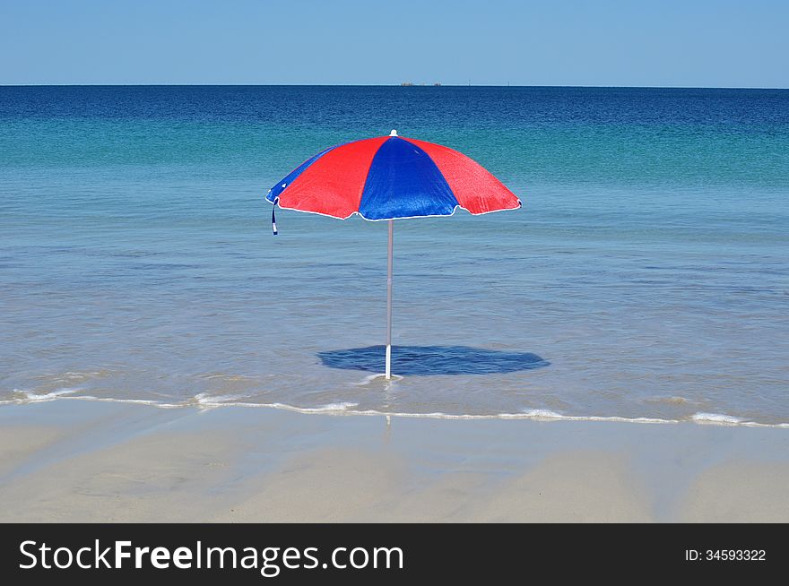 Umbrella On Tropical Beach In The Sun