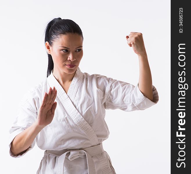 Asian woman in kimono show block in martial art exercise. Asian woman in kimono show block in martial art exercise