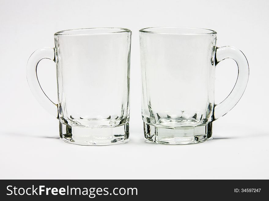 Two glass cups with handle isolated on white background