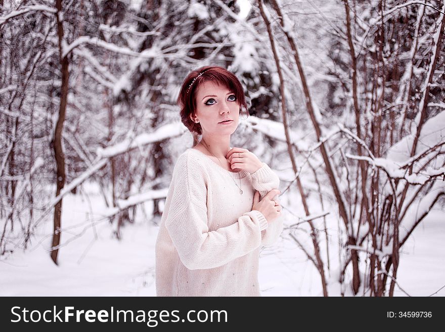 Dreaming girl standing in snow forest. Dreaming girl standing in snow forest