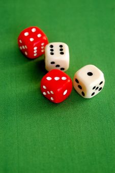 Red And White Dice On Green Royalty Free Stock Image