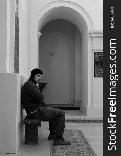Man in church waiting for a prayer