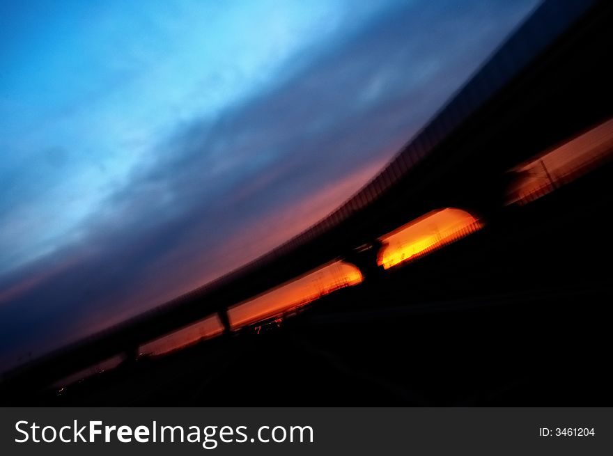 Highway at dawn shoot from a moving car, blur effect
