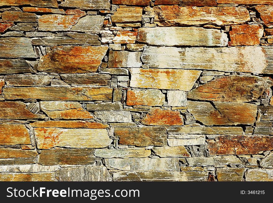 Detail of a colorful stone wall