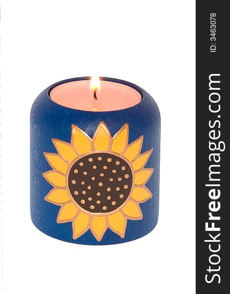Wooden candle with Sun symbol on white background