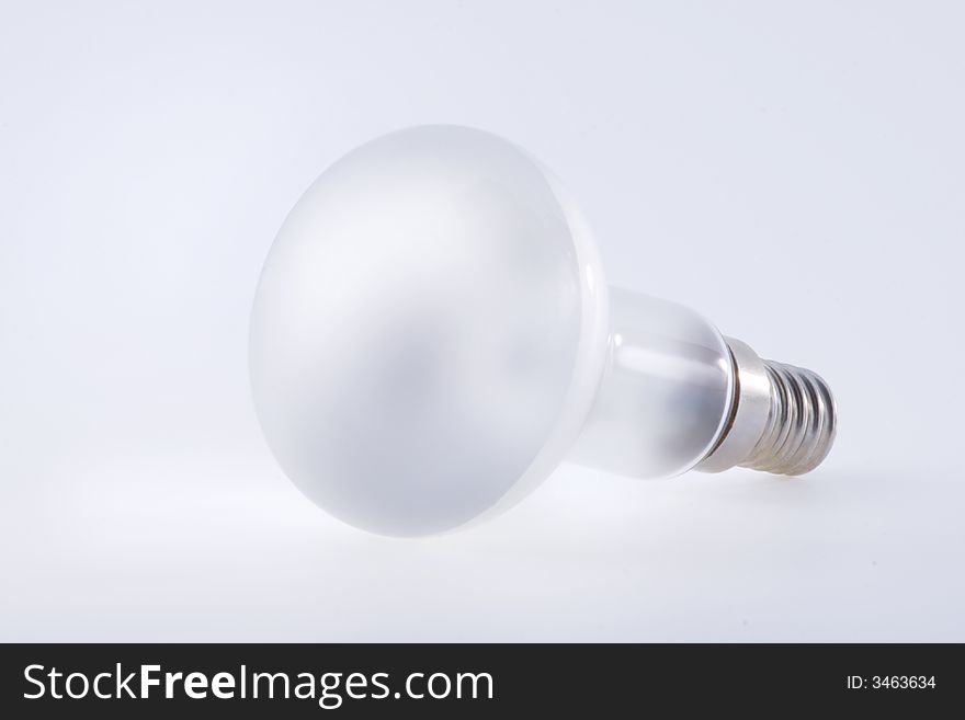 White electric bulb over a white background. White electric bulb over a white background