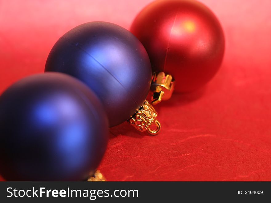 Three red and blue christmas baubles ,christmas decoration. Three red and blue christmas baubles ,christmas decoration