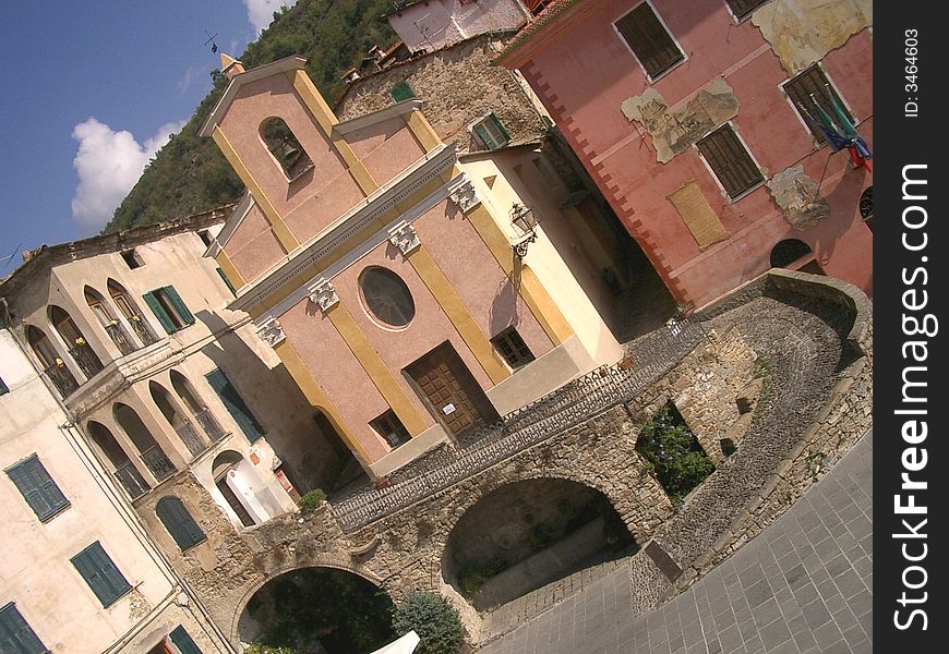 View of the little square of Apricale, a ligurian medioeval village celebrated by poets and writers and painted by famous painters. Aprical is in Liguria, Italy, and it is frequented and loved by artists.