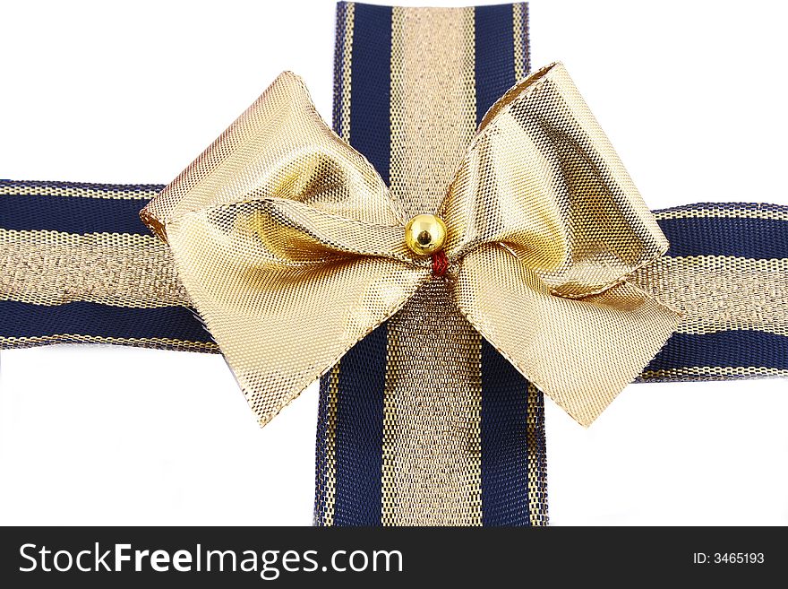 Gift golden ribbon and bow isolated on white.