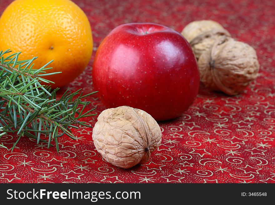 Christmas still life with apple and walnuts