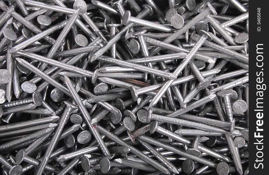 Technological metal background from the steel nails. Technological metal background from the steel nails