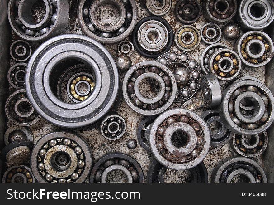 Technological metal background from the many bearings. Technological metal background from the many bearings
