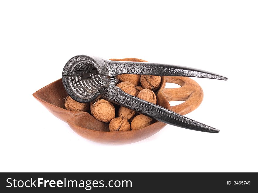 Nutcracker and nuts on the white background