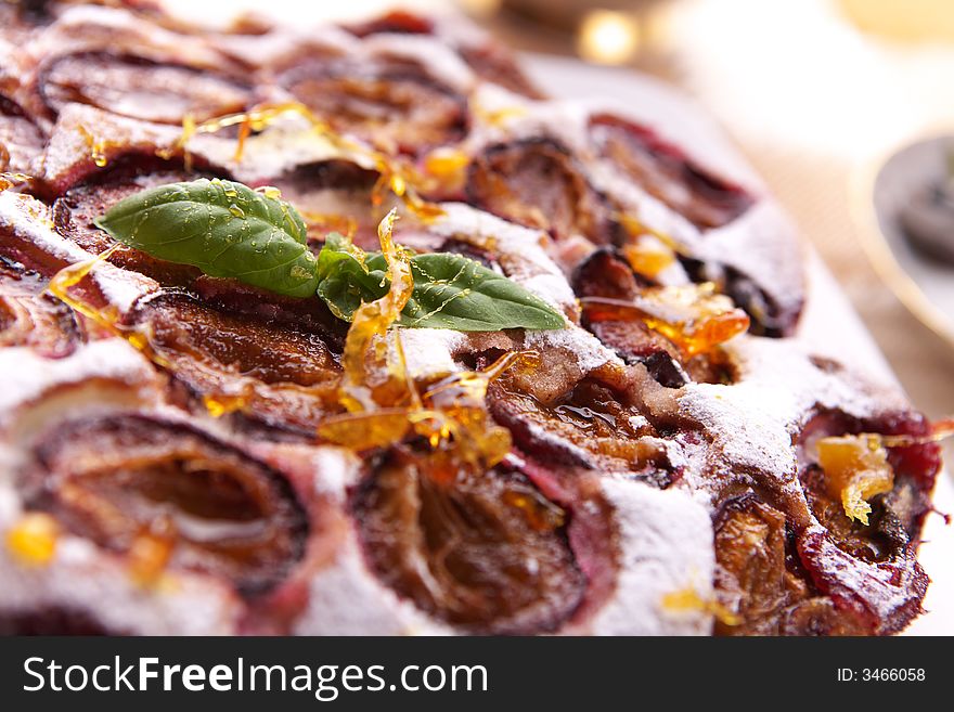 Fresh delicious plum cake close-up