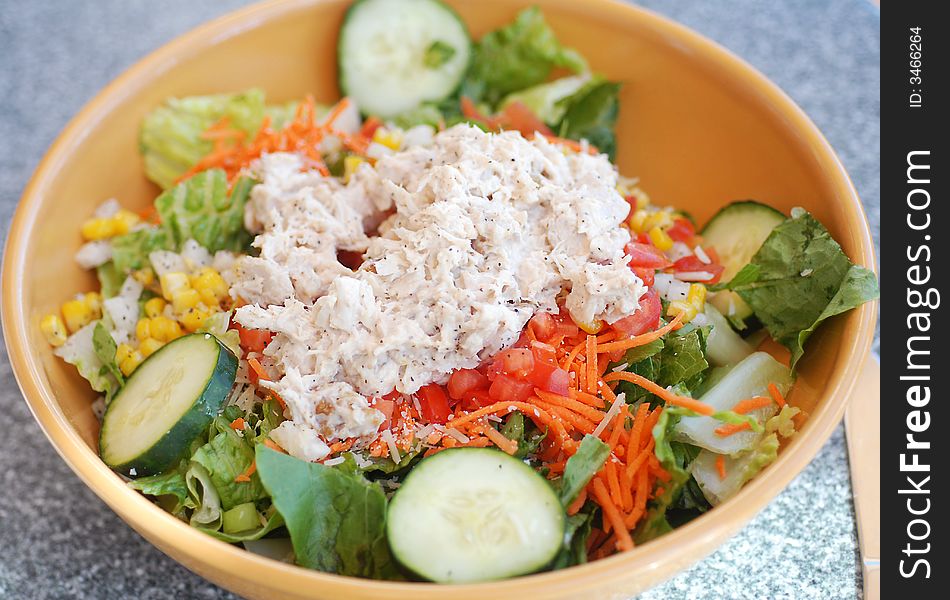 Delicious healthy salad in large ceramic bowl