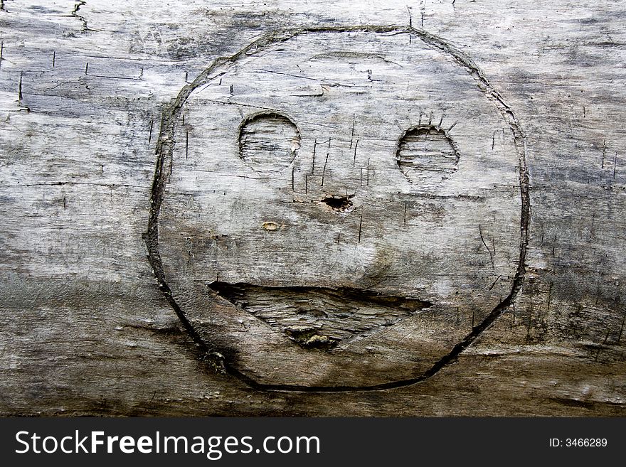 Smile graven in wood