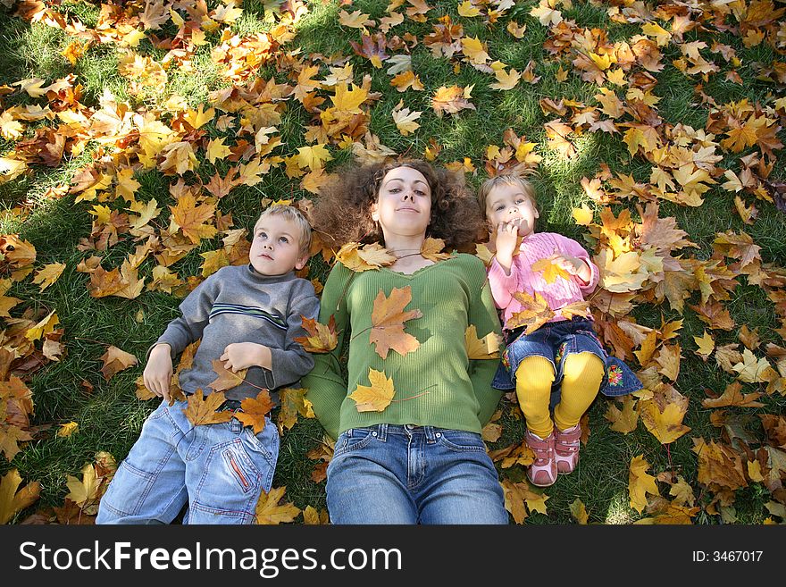 Mom With Children On Grass2
