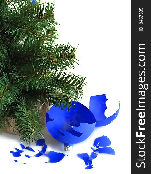 Pieces of broken blue ball with Christmas tree