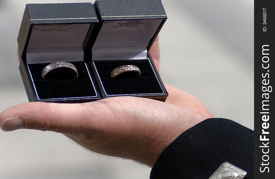 An image of two celtic wedding rings being held by the best man