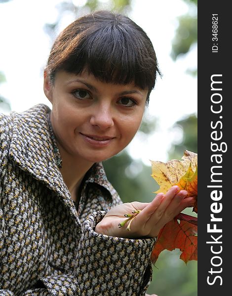 Beautiful woman walking in the autumn park. Beautiful woman walking in the autumn park