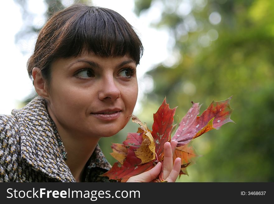 Beautiful woman walking in the autumn park. Beautiful woman walking in the autumn park