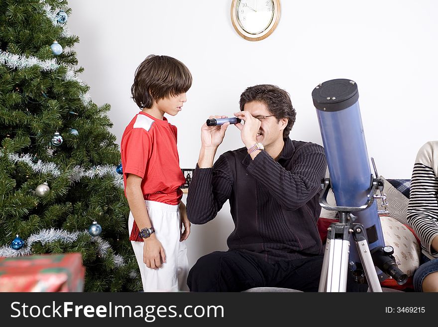 Happy family having fun and opening gift at christmas time. Happy family having fun and opening gift at christmas time