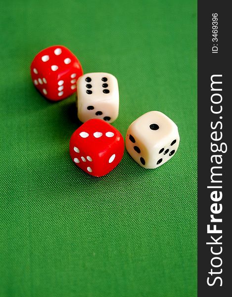 Red And White Dice On Green