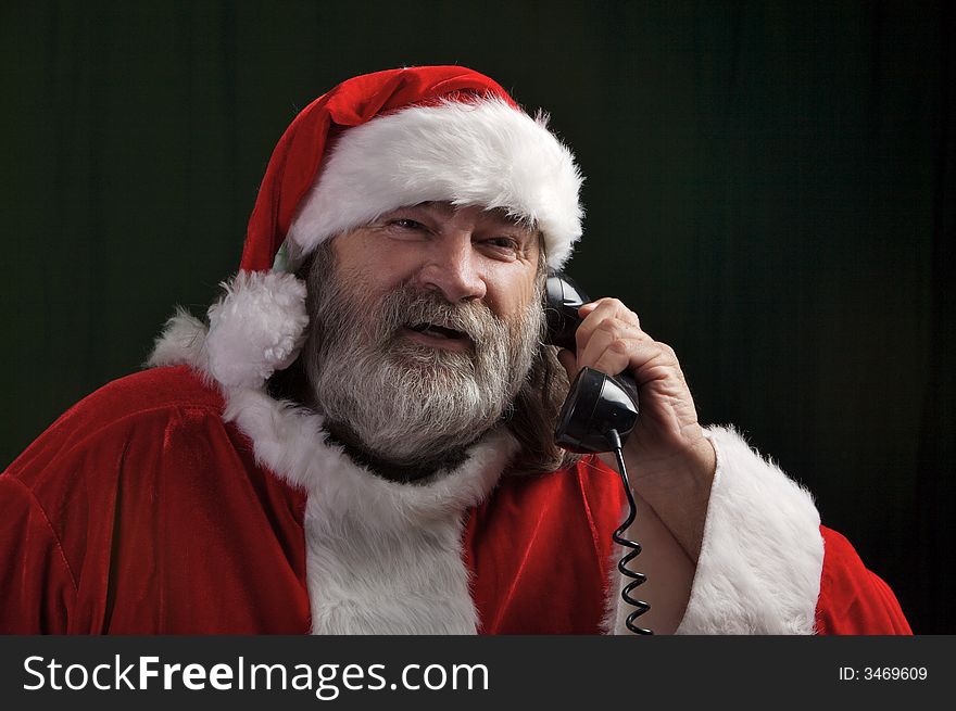 A young Santa with gray hair and beard having a good time
