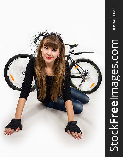The pretty, young girl with bike. Isolated on white.